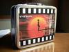 Noir lunch box signed by Monica Rial
