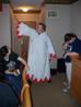 John tries on Jen's White Mage robe, while Heather and Jen look on. Note Jen's priceless expression.