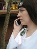 Heather as Neji with a cell phone
